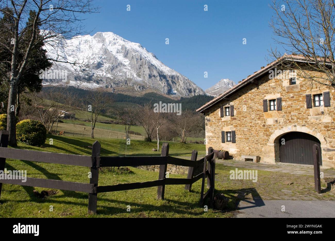 Mount Amboto and rural house, Axpe, Valley of Atxondo, Biscay, Basque Country, Spain. Stock Photo