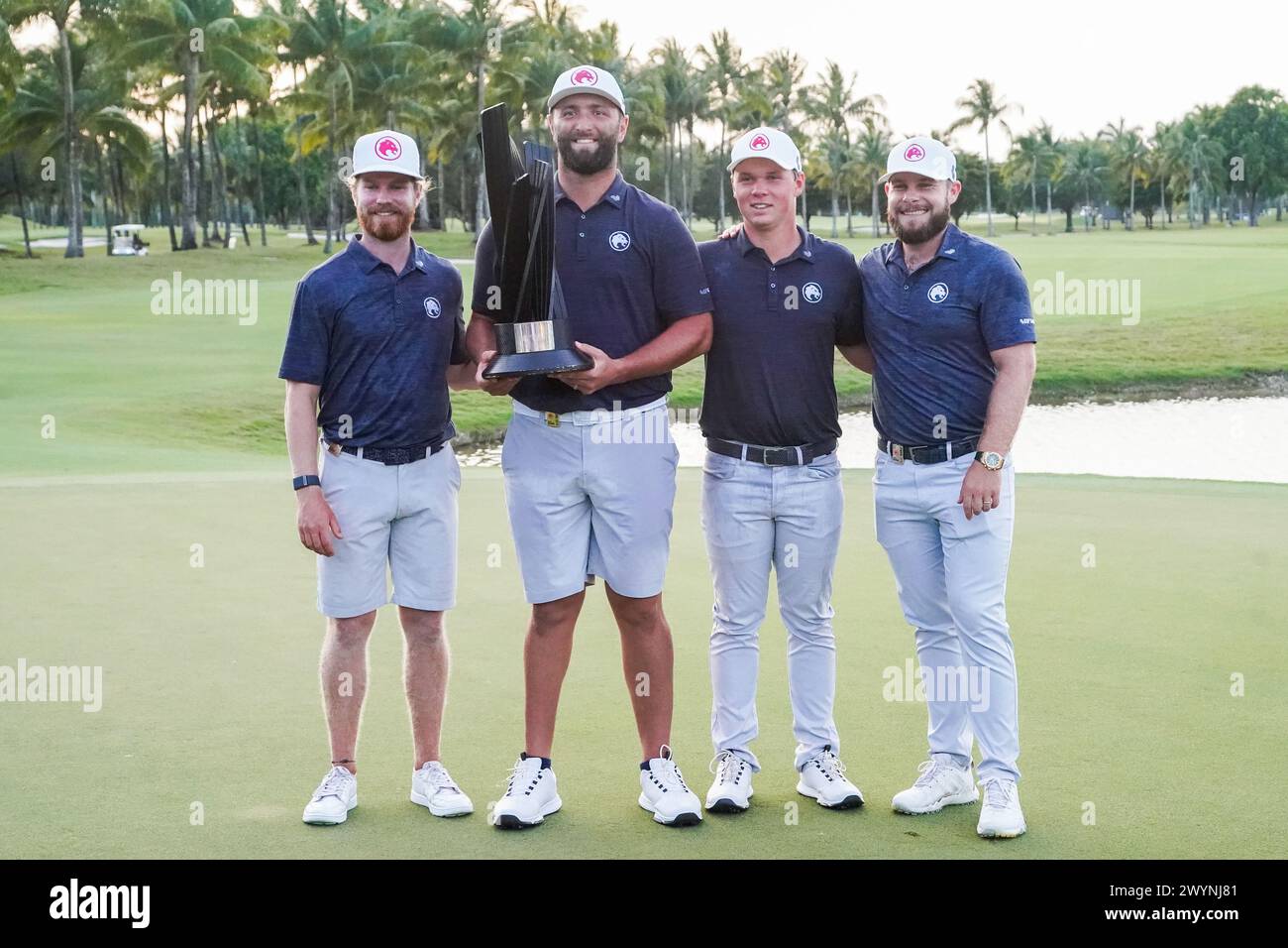 Doral, Florida, USA. 7th Apr, 2024. (L-R) Kieran Vincent, Jon Rahm, Caleb Surratt and Tyrrell Hatton of Legion XIII pose with the trophy after winning the team event after the final round of LIV Golf Miami at Trump National Doral. (Credit Image: © Debby Wong/ZUMA Press Wire) EDITORIAL USAGE ONLY! Not for Commercial USAGE! Stock Photo