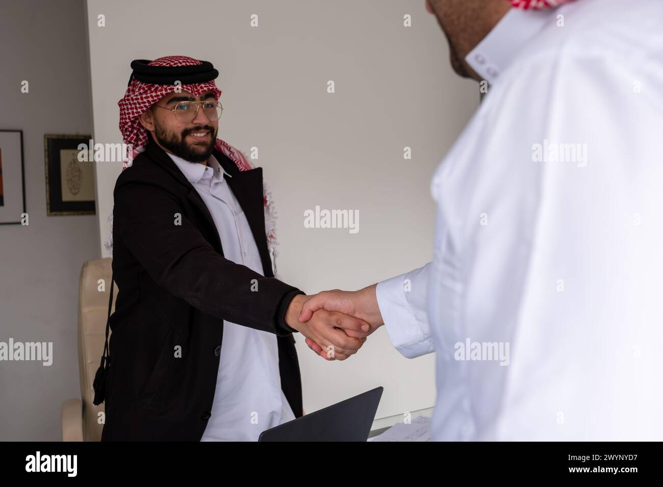 Arab shaking hands friendly and lovely Stock Photo