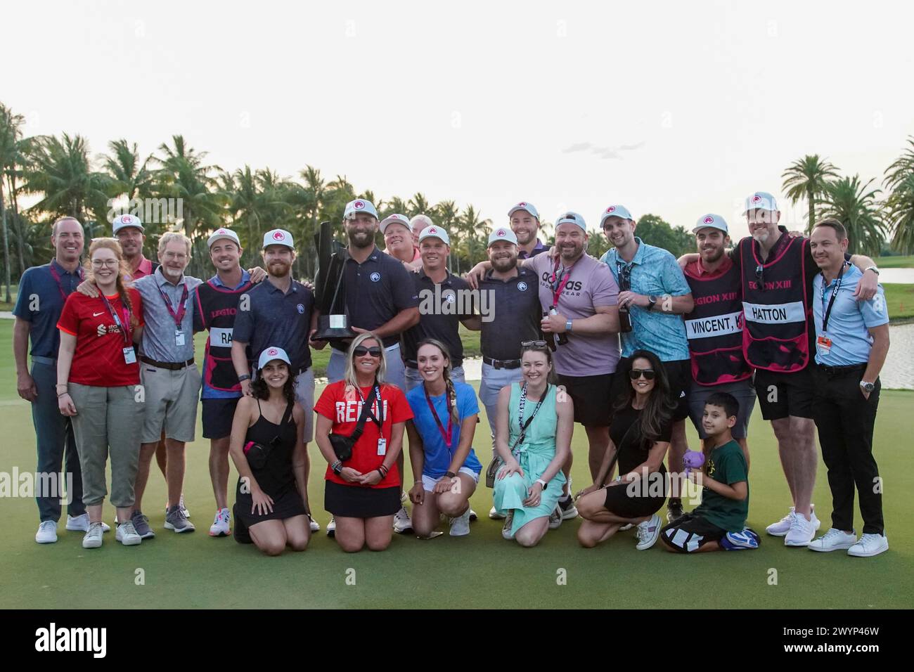 Doral, Florida, USA. 7th Apr, 2024. Team Legion XIII and their families pose for photos on the 18th green after winning the team event on the final day of LIV Golf Miami at Trump National Doral. (Credit Image: © Debby Wong/ZUMA Press Wire) EDITORIAL USAGE ONLY! Not for Commercial USAGE! Stock Photo