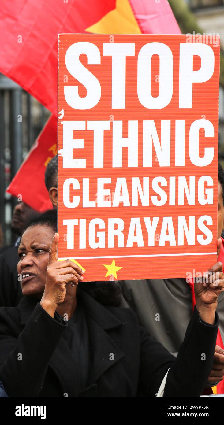 A protester holds a placard that says 'Stop Ethnic Cleansing Tigrayans ...