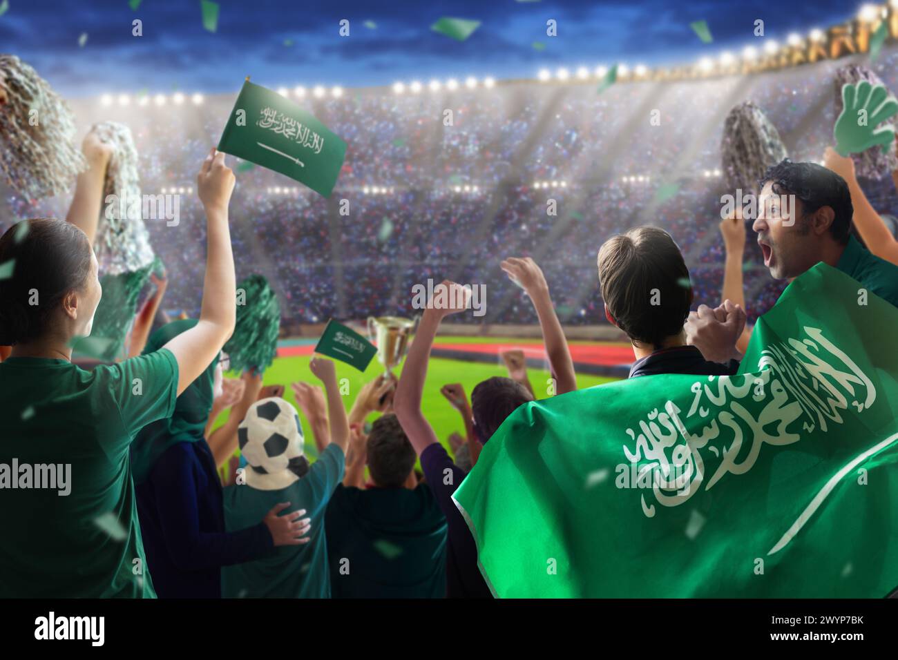 Saudi Arabia football supporter on stadium. Saudi Arabian fans on soccer pitch watching team play. Group of supporters with flag and national jersey Stock Photo