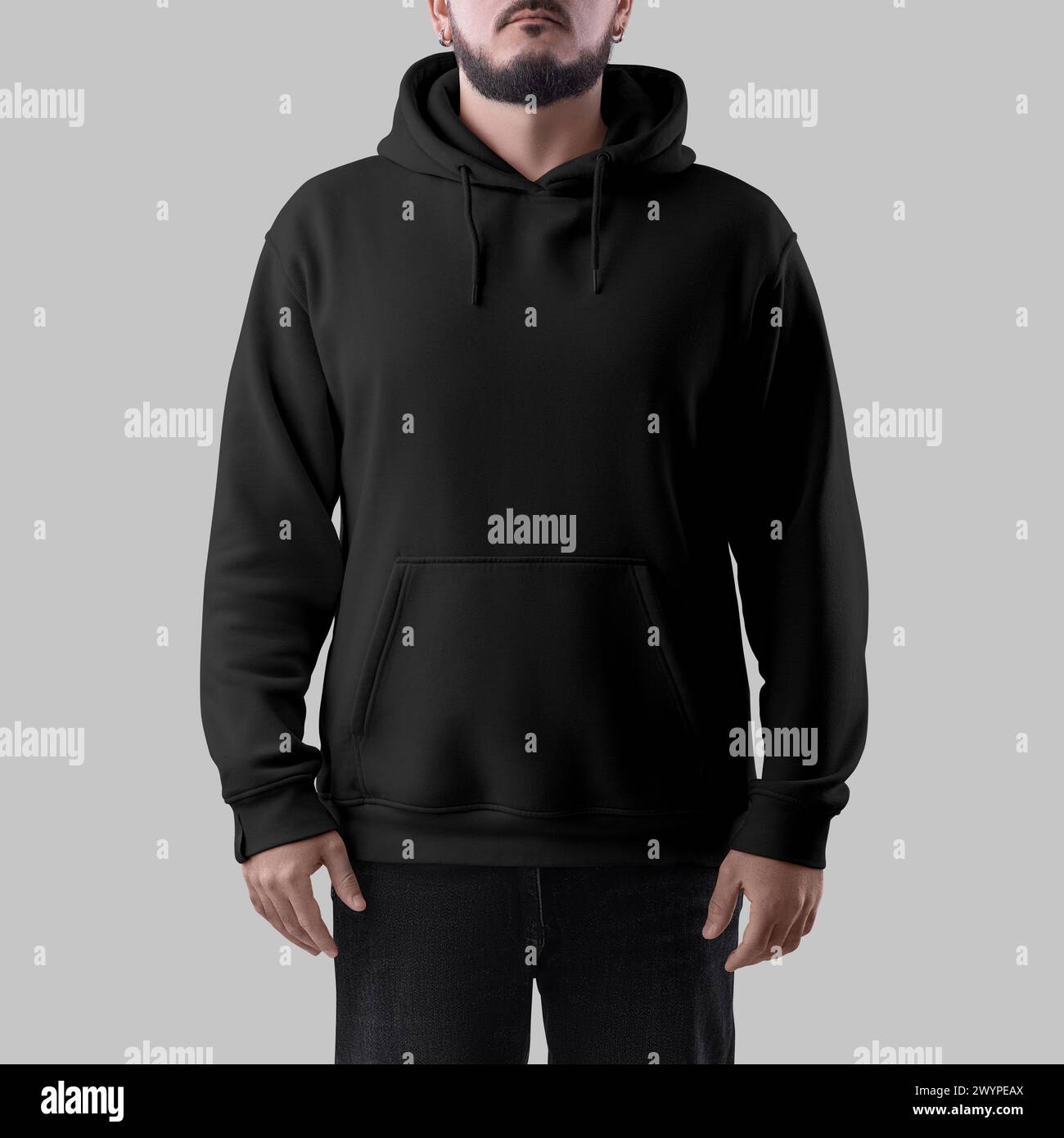 Mockup of a black oversized hoodie on a bearded man, for design, branding, advertising, front view. Fashion clothing template with laces, cuffs, pocke Stock Photo