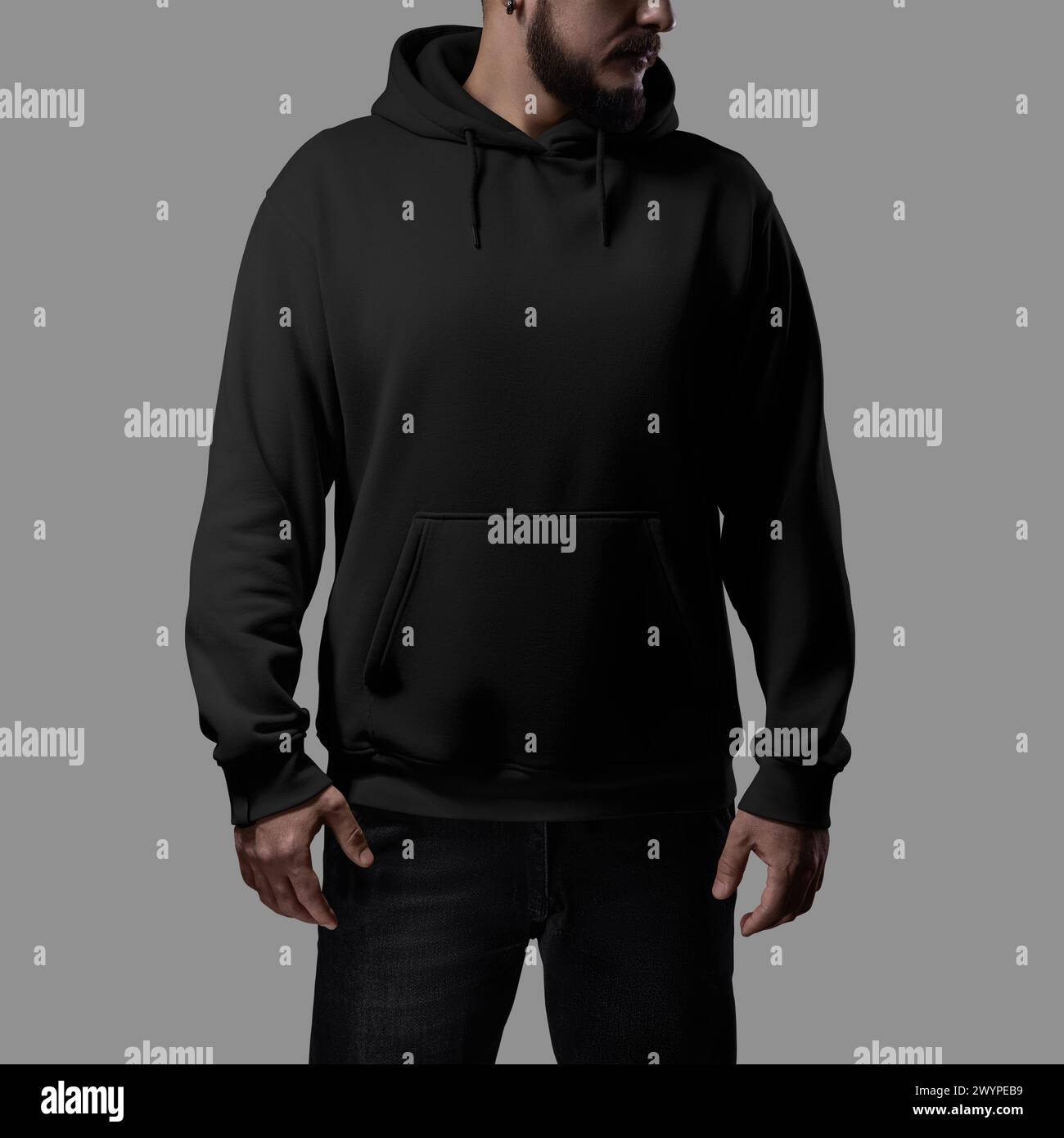 Template of a black oversized hoodie on a bearded man, for design, branding, advertising, front. Casual clothing mockup with laces, cuffs, pocket, hoo Stock Photo