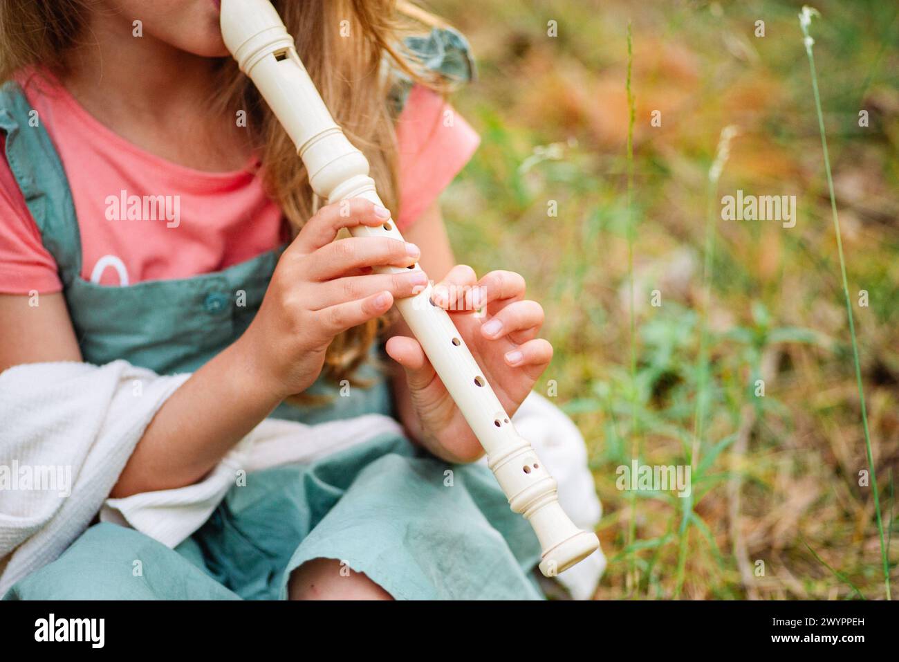 girl with violin in the forest. girl play music Stock Photo