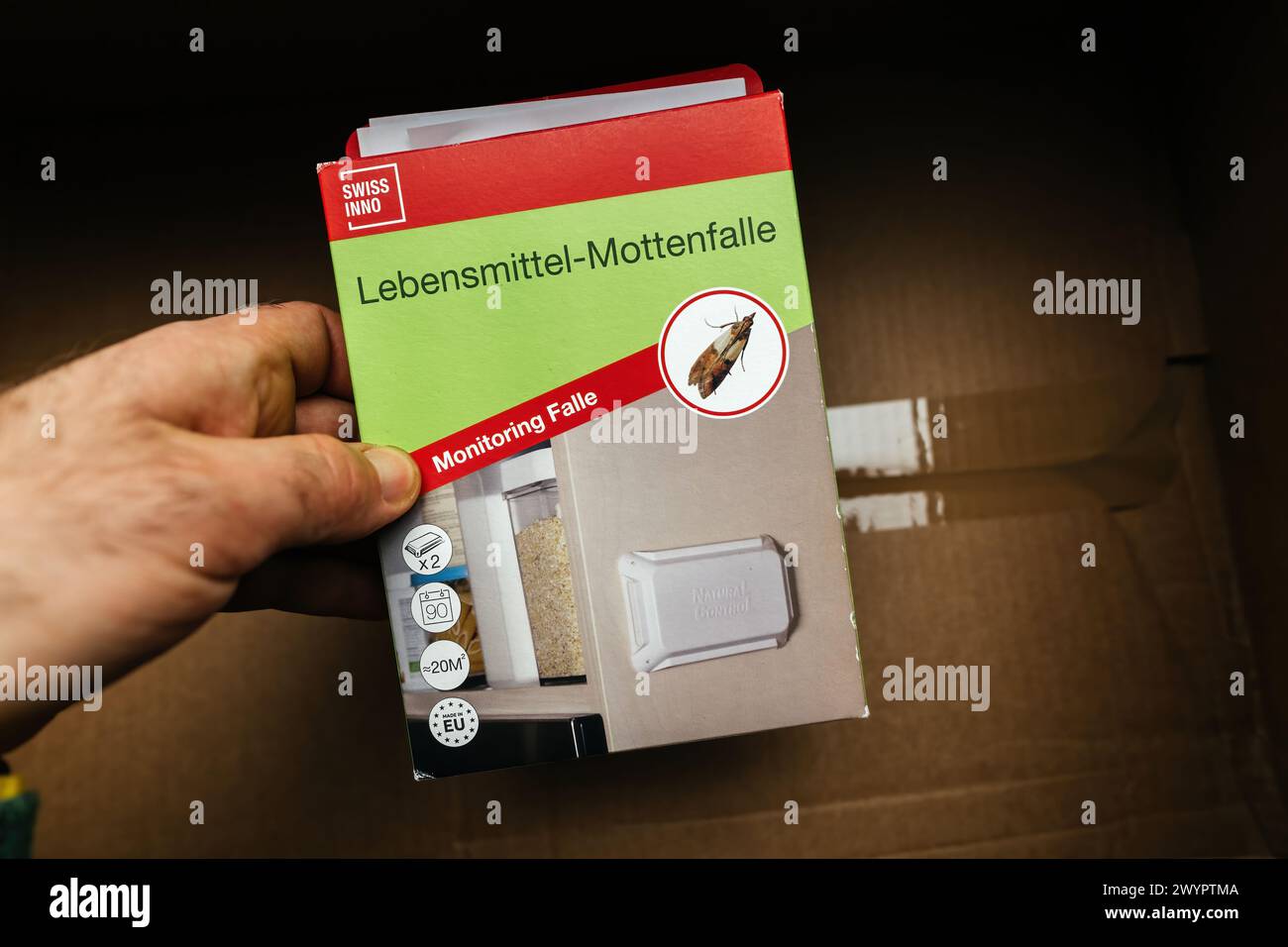 Paris, France Mar 9, 2024 Holding a Swiss Inno box of pantry moth