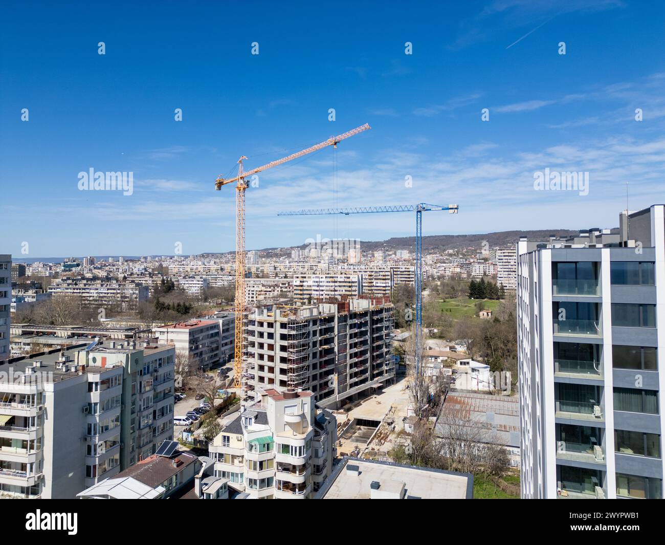 Busy Construction Site With Cranes and Buildings Stock Photo - Alamy