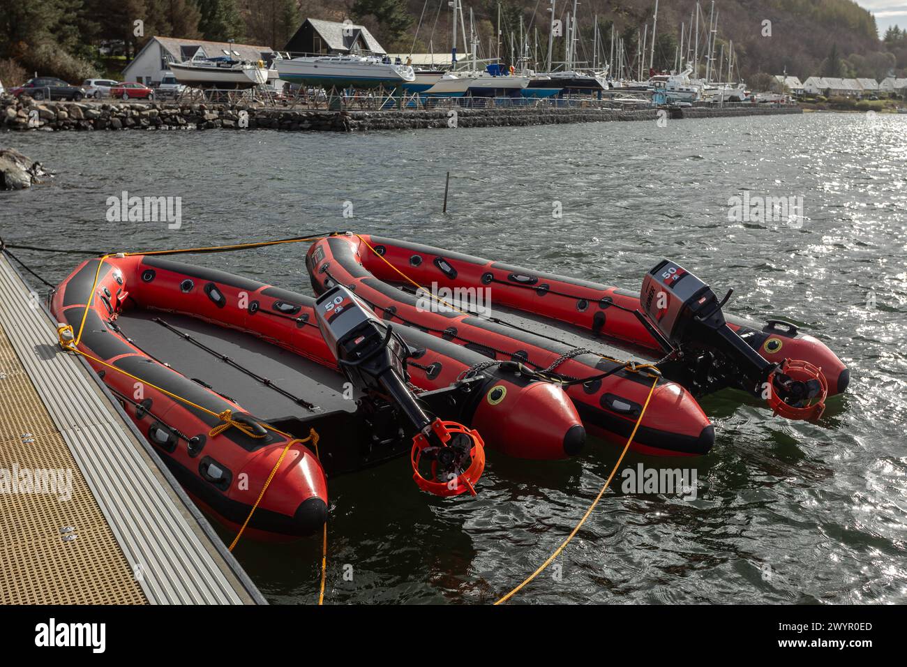 Red Scottish Fire Rescue dinghies in Dunstaffnage marina Stock Photo