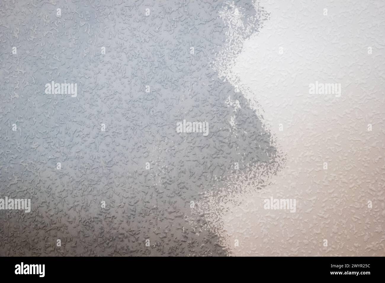 grey painted woodchip wallpaper texture pattern backgroung. Stock Photo