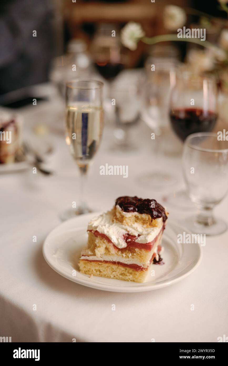 Wedding cake slice on elegant table setting Stock Photo