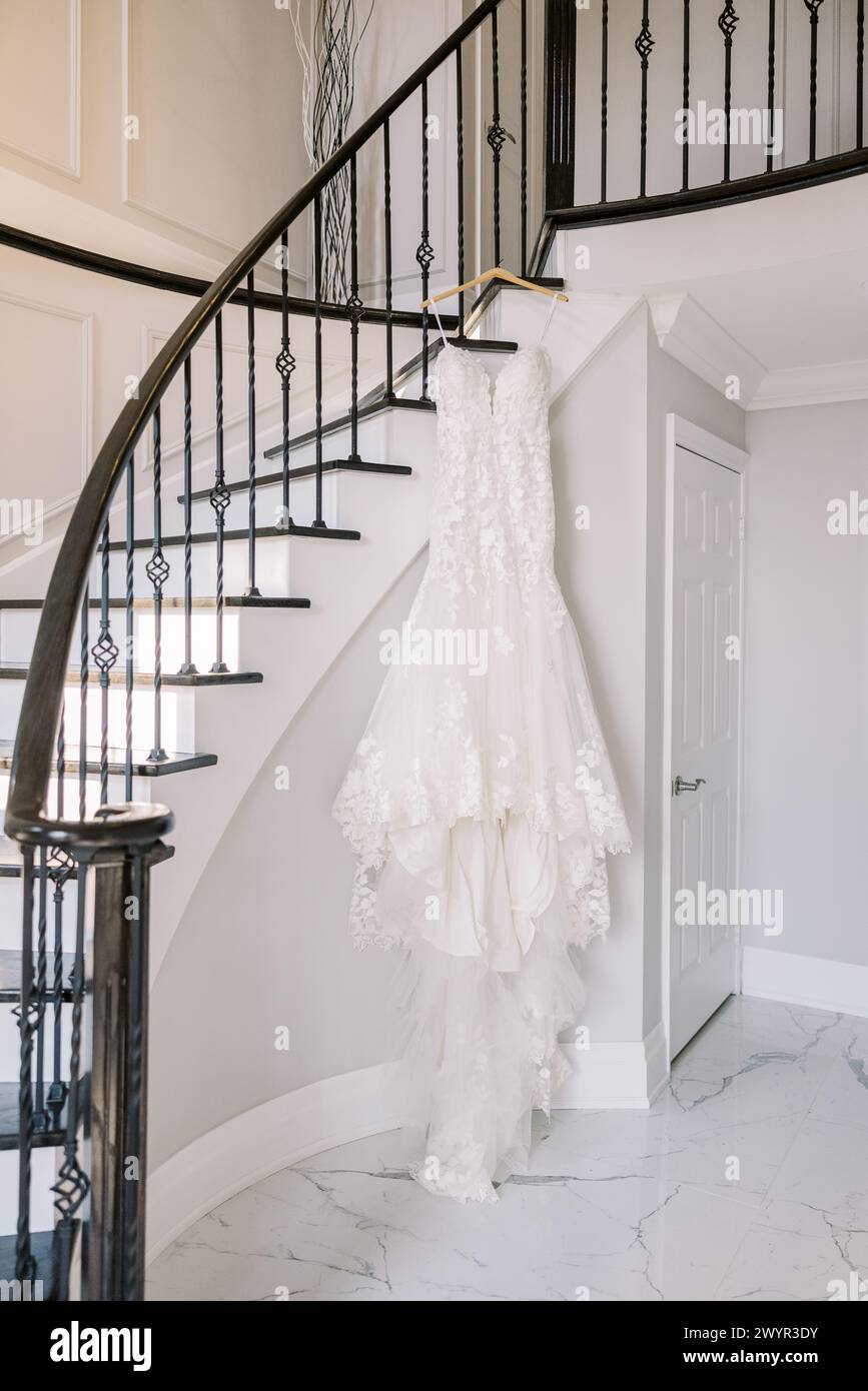 Elegant bridal gown on staircase Stock Photo