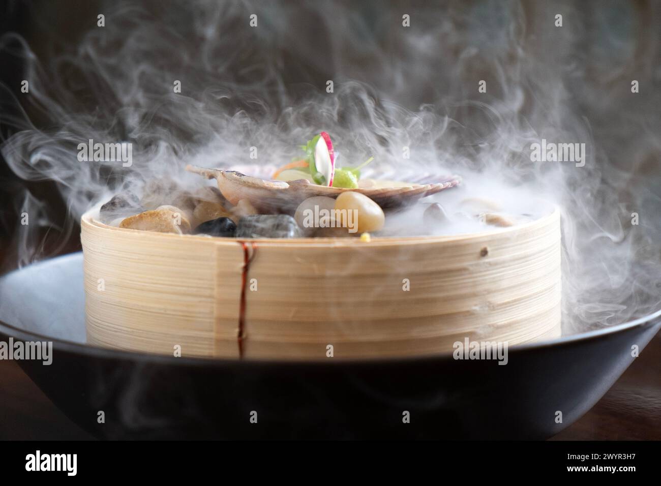 Fancy seafood dish with dry ice fog Stock Photo