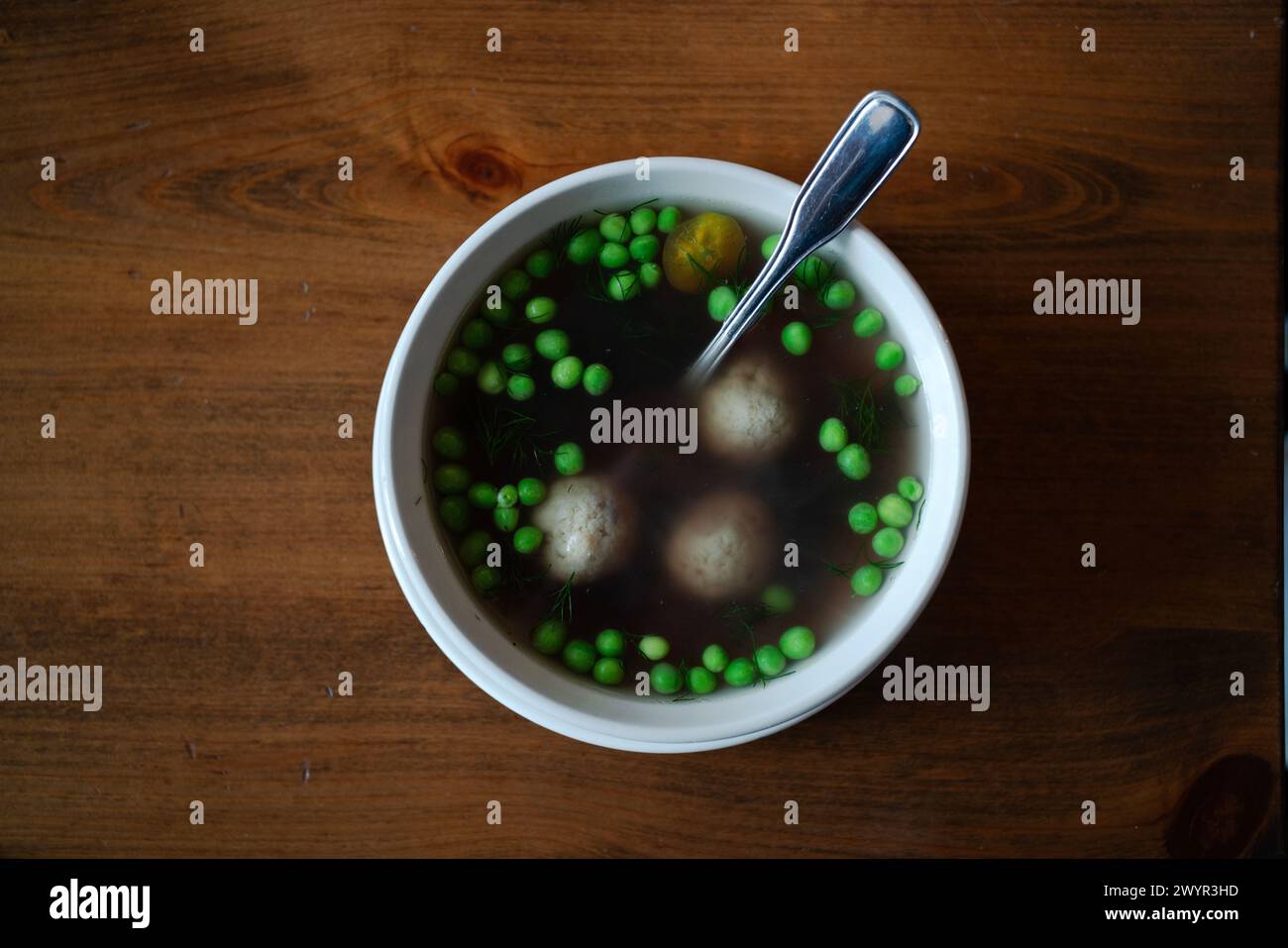 Looking down on bowl of matzo ball soup Stock Photo