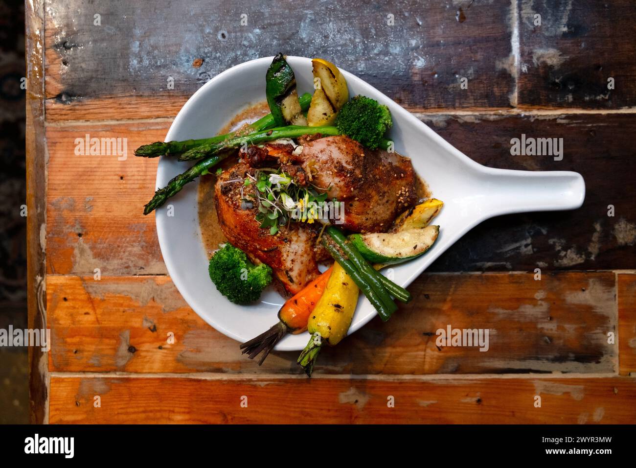 Overhead view of chicken dish on table in restaurant Stock Photo