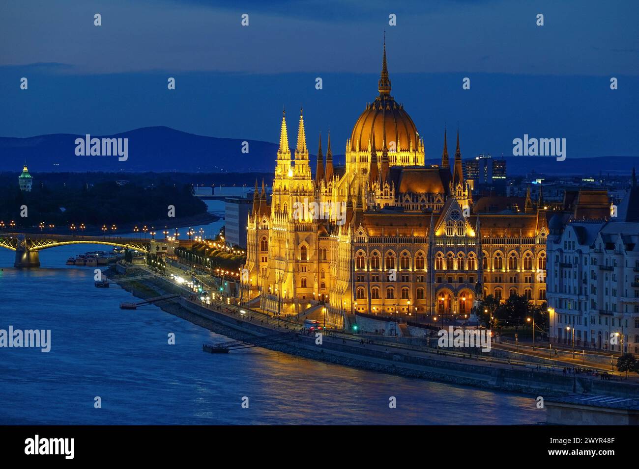 Hungary, Budapest, Night view of the Neo-Gothic Hungarian Parliament building and Danubio river. The Hungarian Parliament Building also known as the P Stock Photo