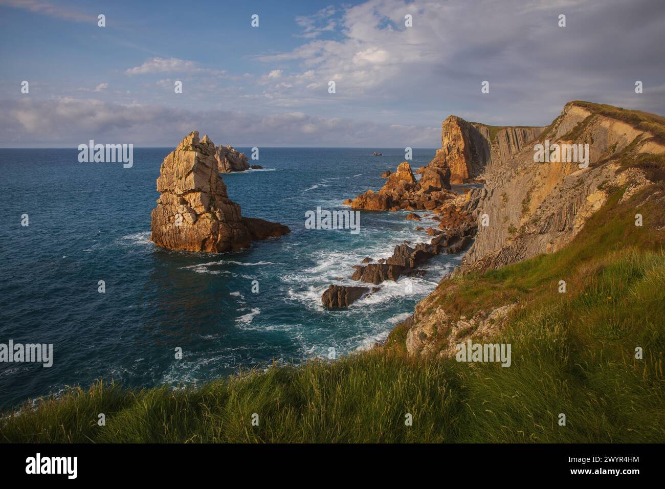 Sunset over Geological formations in Costa Quebrada Stock Photo