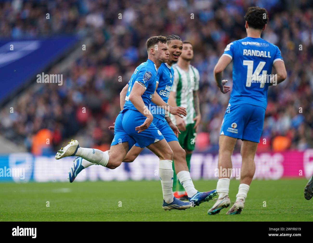 LONDON, ENGLAND - APRIL 7: Harrison Burrows of Peterborough United celebrating his goal to make it 2-1 during the Bristol Street Motors Trophy Final between Peterborough United and Wycombe Wanderers at Wembley Stadium on April 7, 2024 in London, England. (Photo by Dylan Hepworth/MB Media) Stock Photo