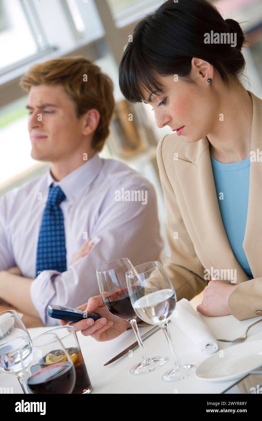 Two businessmen using cell phones hi-res stock photography and images ...
