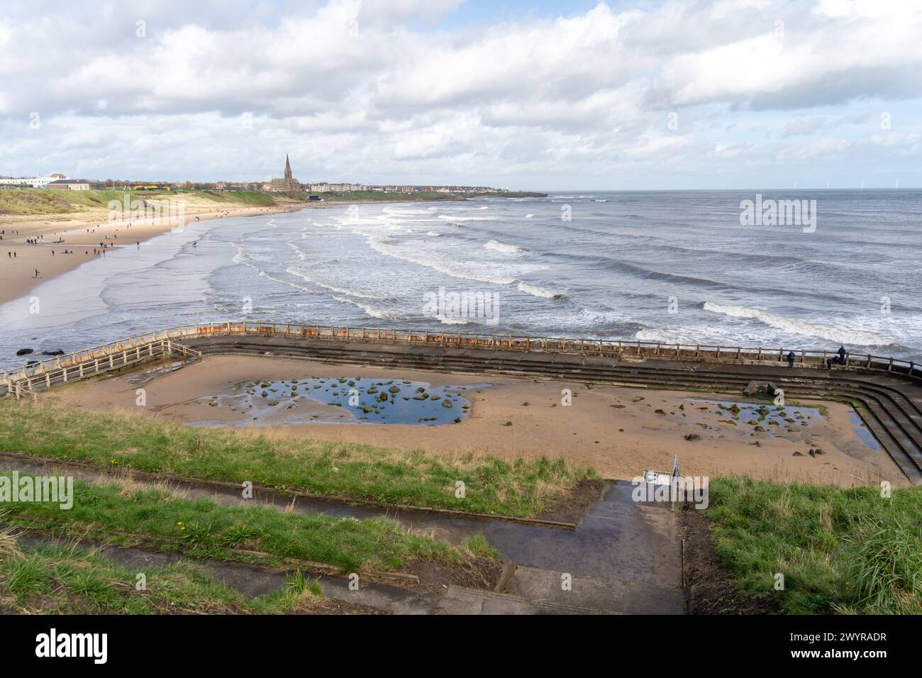 The former Tynemouth Outdoor Swimming Pool by Longsands or Long Sands beach in Tynemouth, North Tyneside, UK. Stock Photo