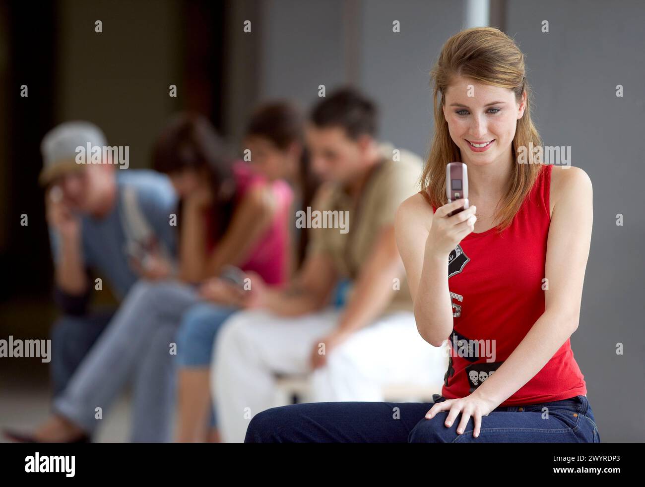 Teen girl sitting knees up hi-res stock photography and images - Alamy