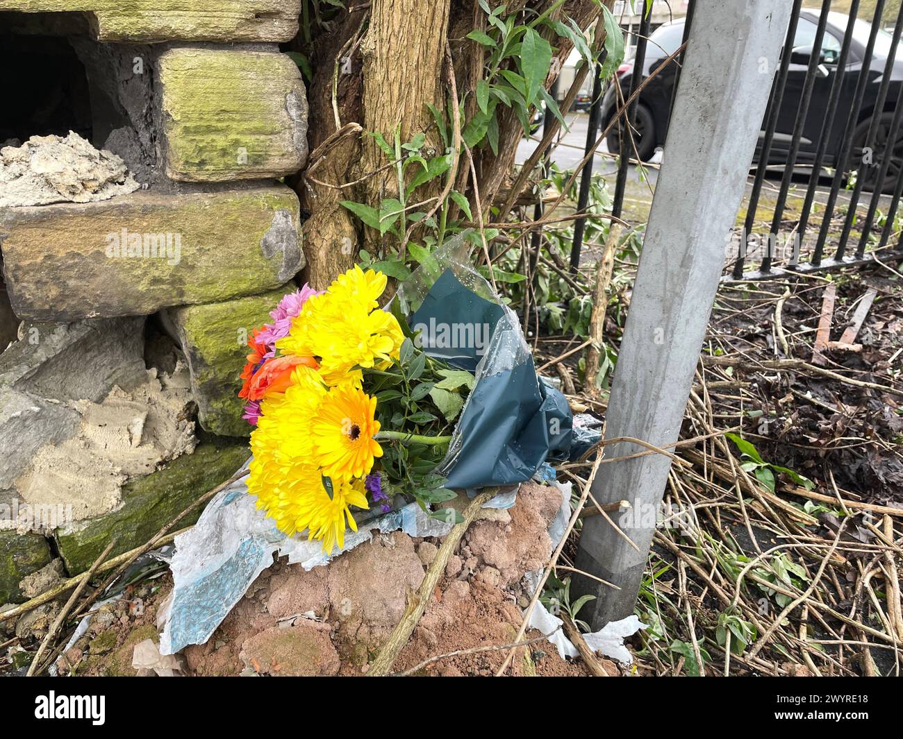 Flowers at the scene in Bradford city centre where a young woman was stabbed to death in the street as she pushed her baby in a pram on Saturday afternoon. Police are searching for Habibur Masum, 25, in connection with the fatal stabbing. Picture date: Monday April 8, 2024. Stock Photo