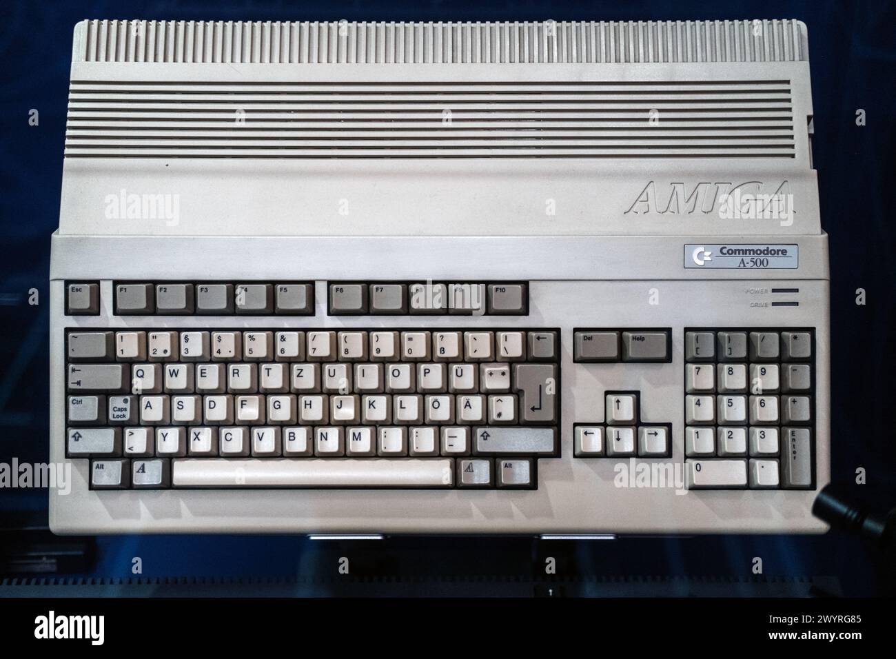 Warsaw, Poland - March 19, 2024. Commodore Amiga A-500 Computer on Blue Stock Photo