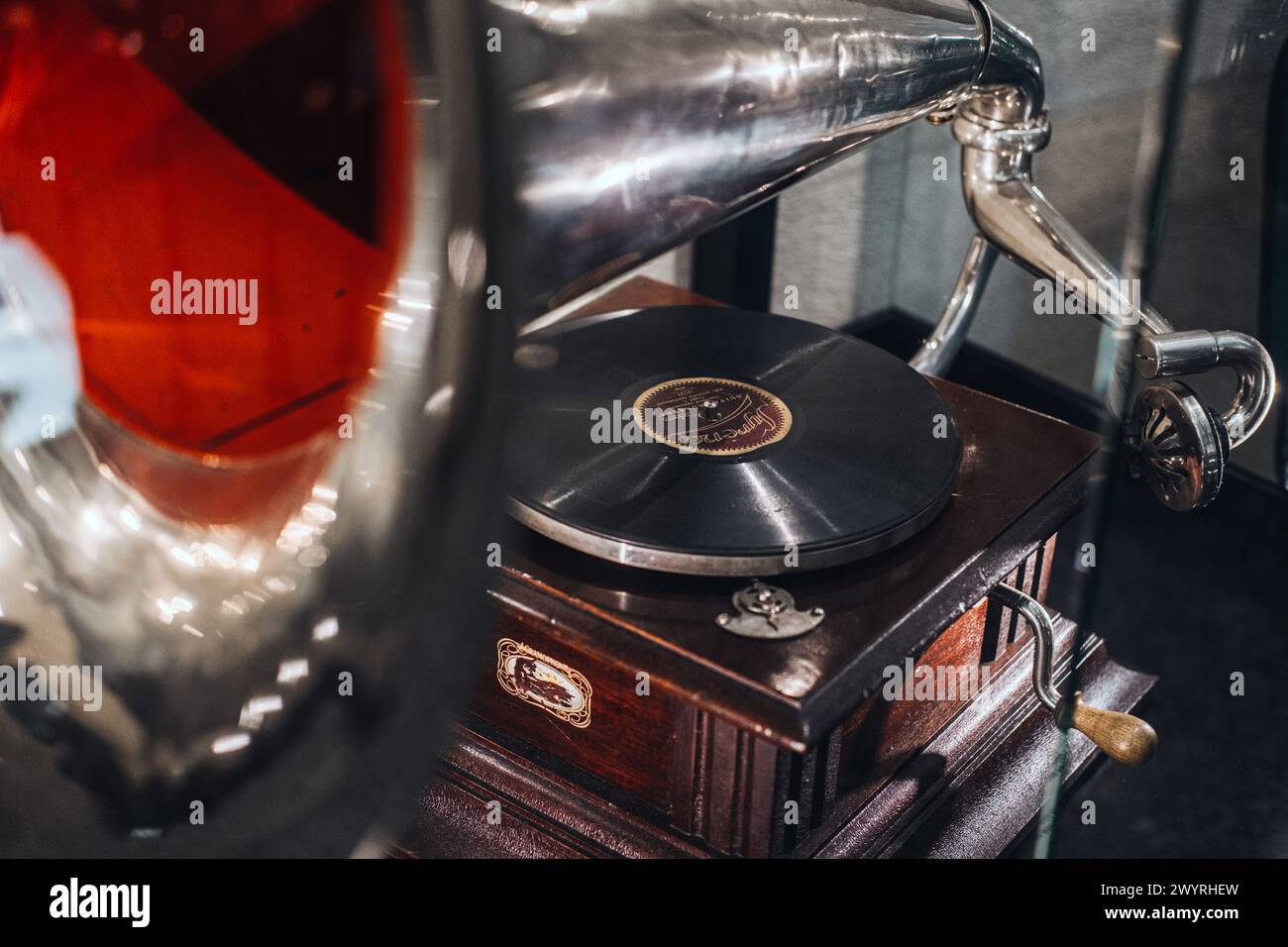 Warsaw, Poland - March 19, 2024. Antique Gramophone with Vinyl Record Stock Photo