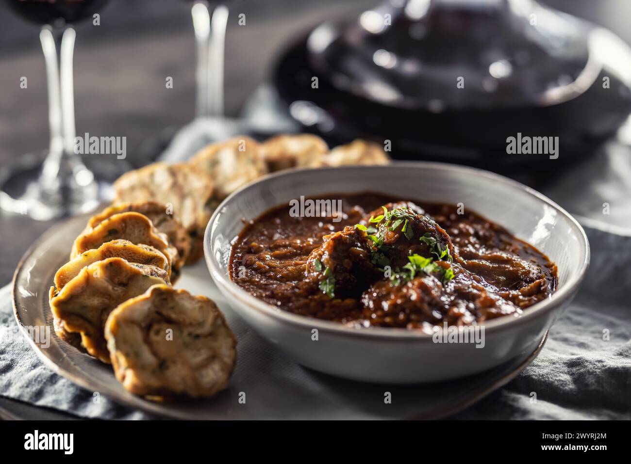 Traditional Viennese, venison or Hungarian goulash with Karlovy Vary dumplings and red wine. Stock Photo
