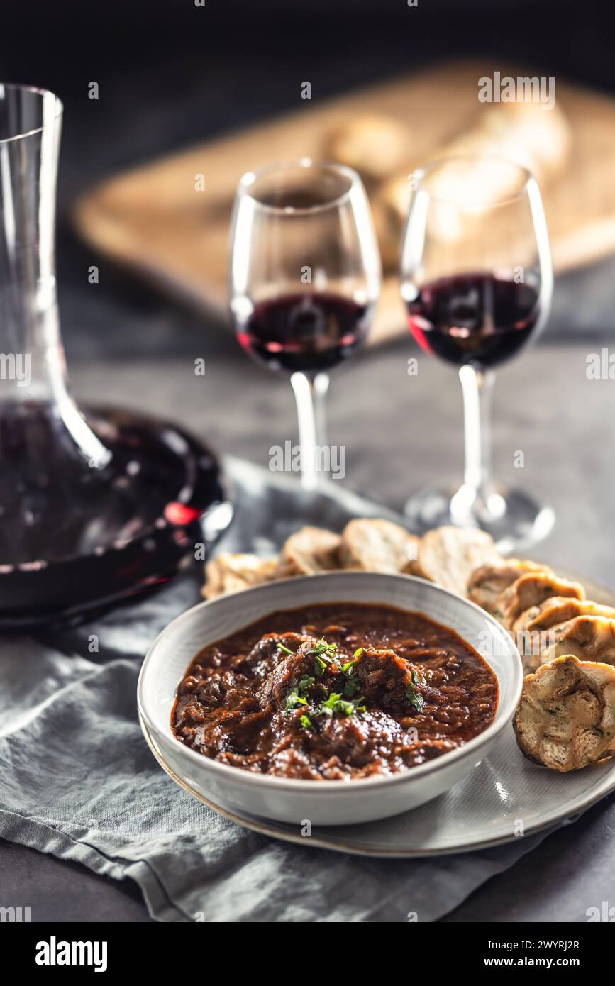 Traditional Viennese, venison or Hungarian goulash with Karlovy Vary dumplings and red wine. Stock Photo