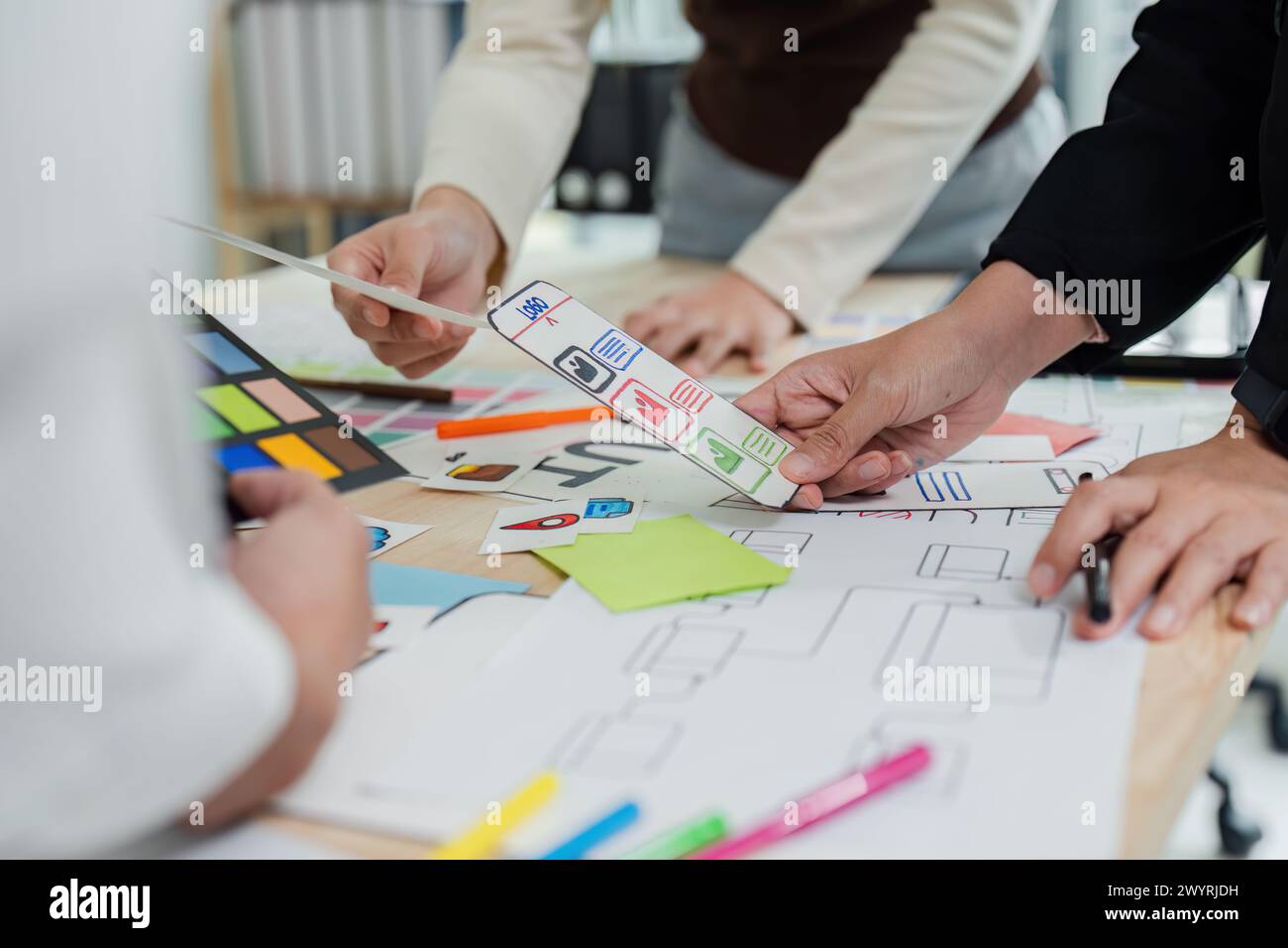 UI designer and UX developer brainstorm idea to design the application ...