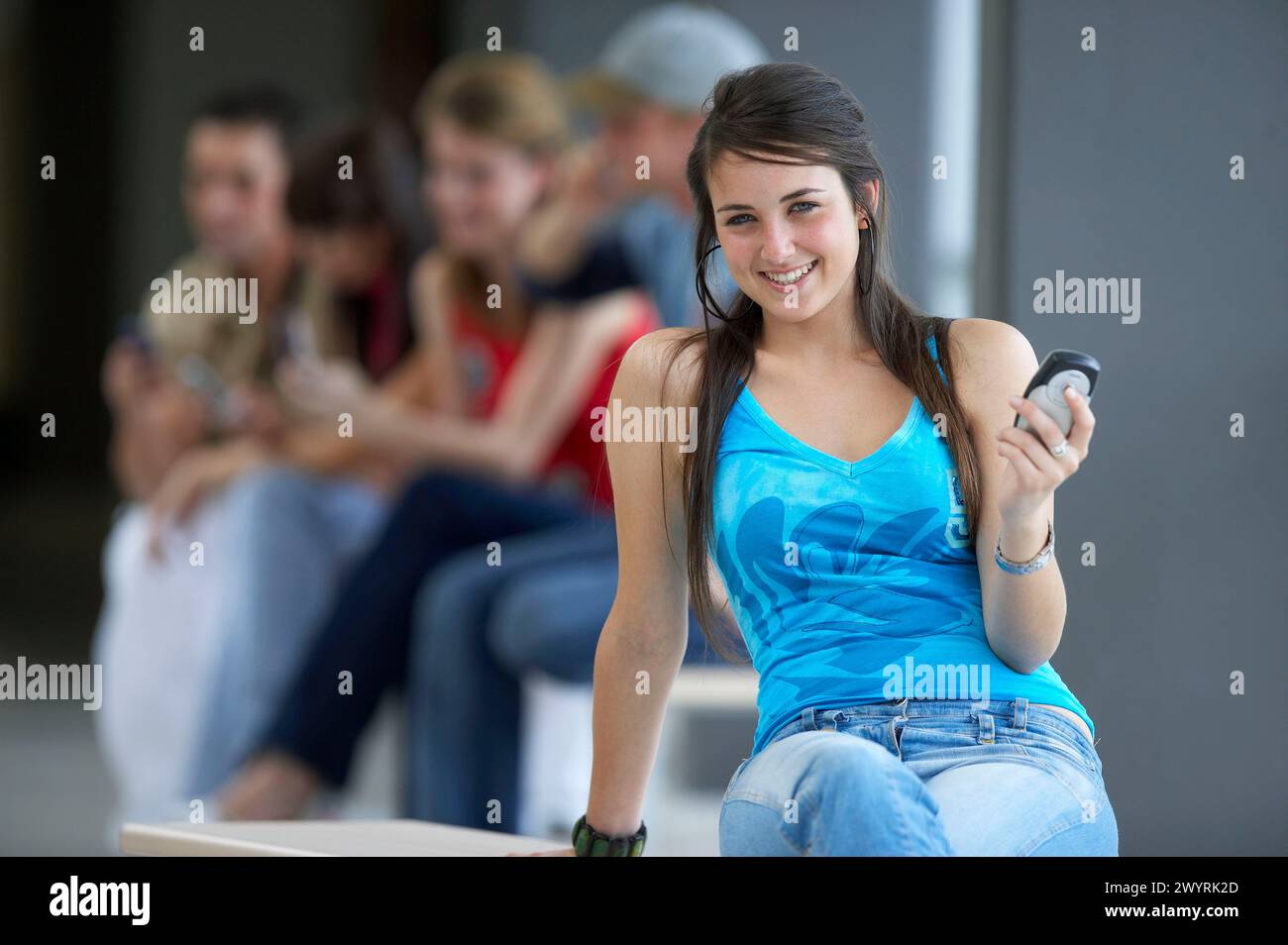 Teen girl sitting knees up hi-res stock photography and images - Alamy