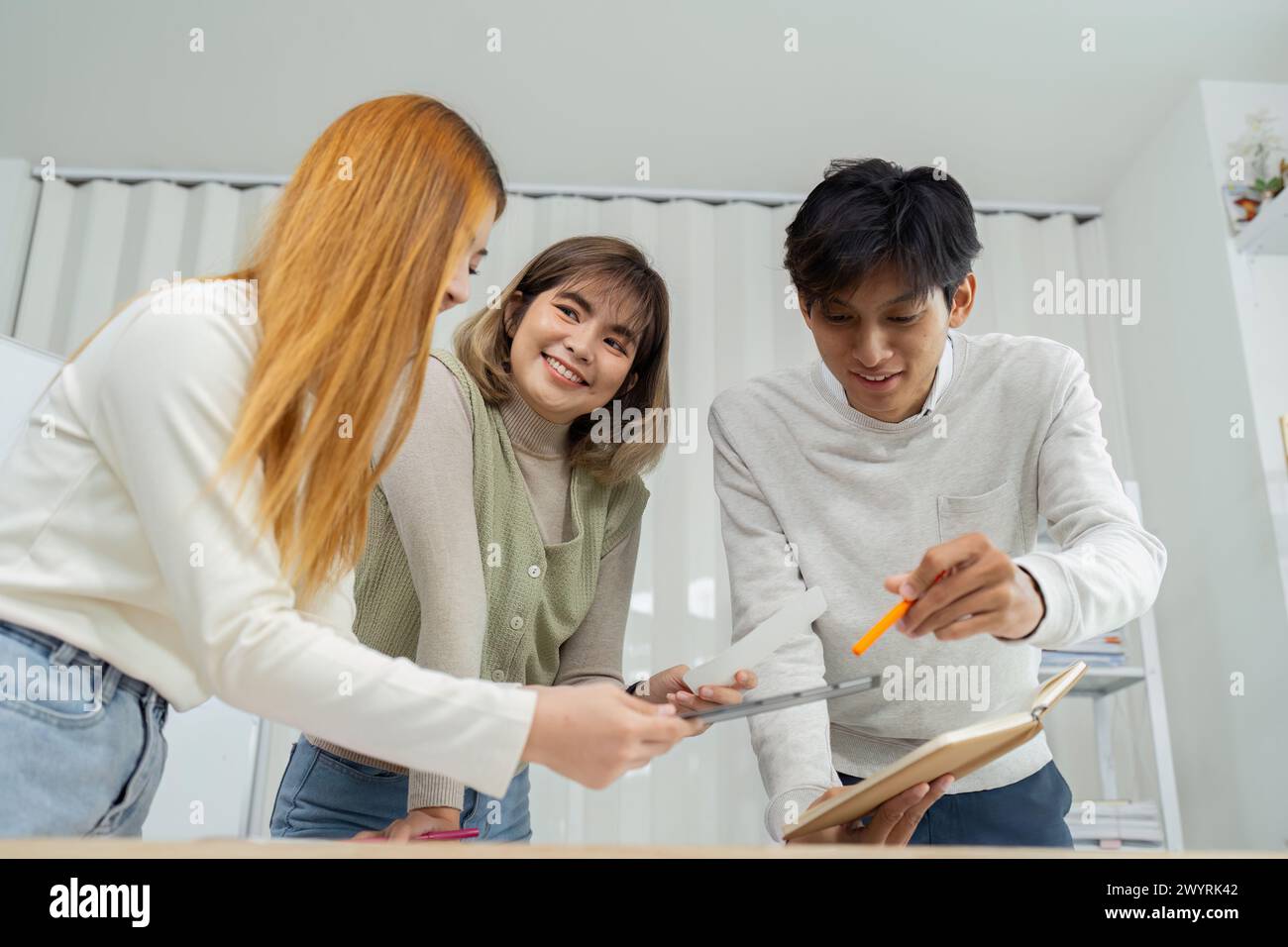 UI designer and UX developer brainstorm idea to design the application ...