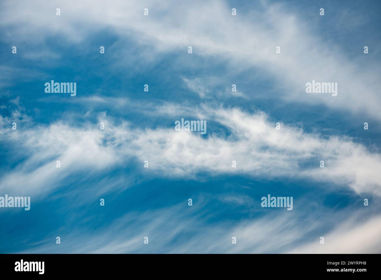Photograph of prominent clouds in a blue sky in sunlight, taken with a polarizing filter Stock Photo