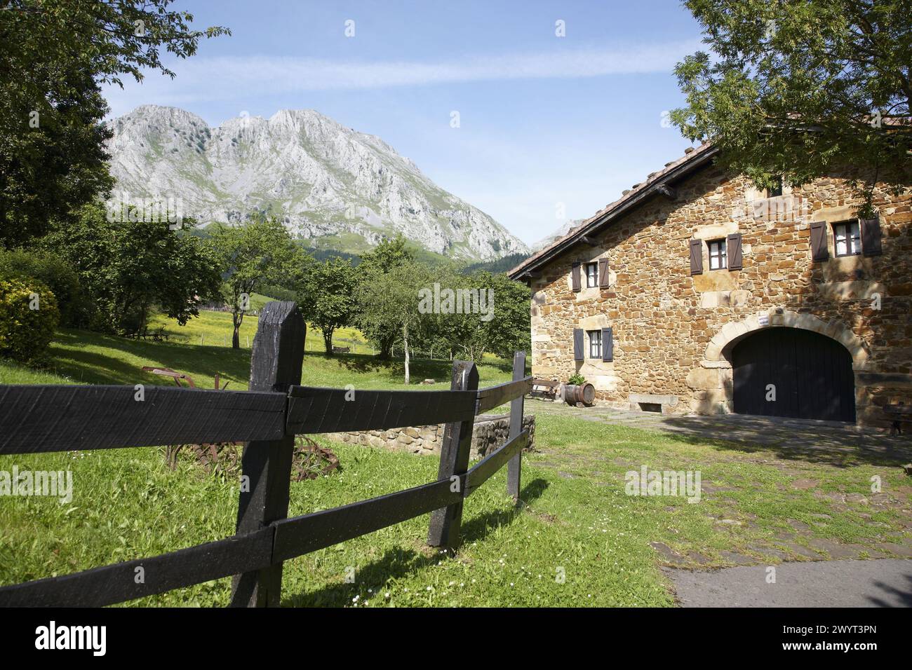Mount Amboto and rural house, Axpe, Valley of Atxondo, Biscay, Basque Country, Spain. Stock Photo