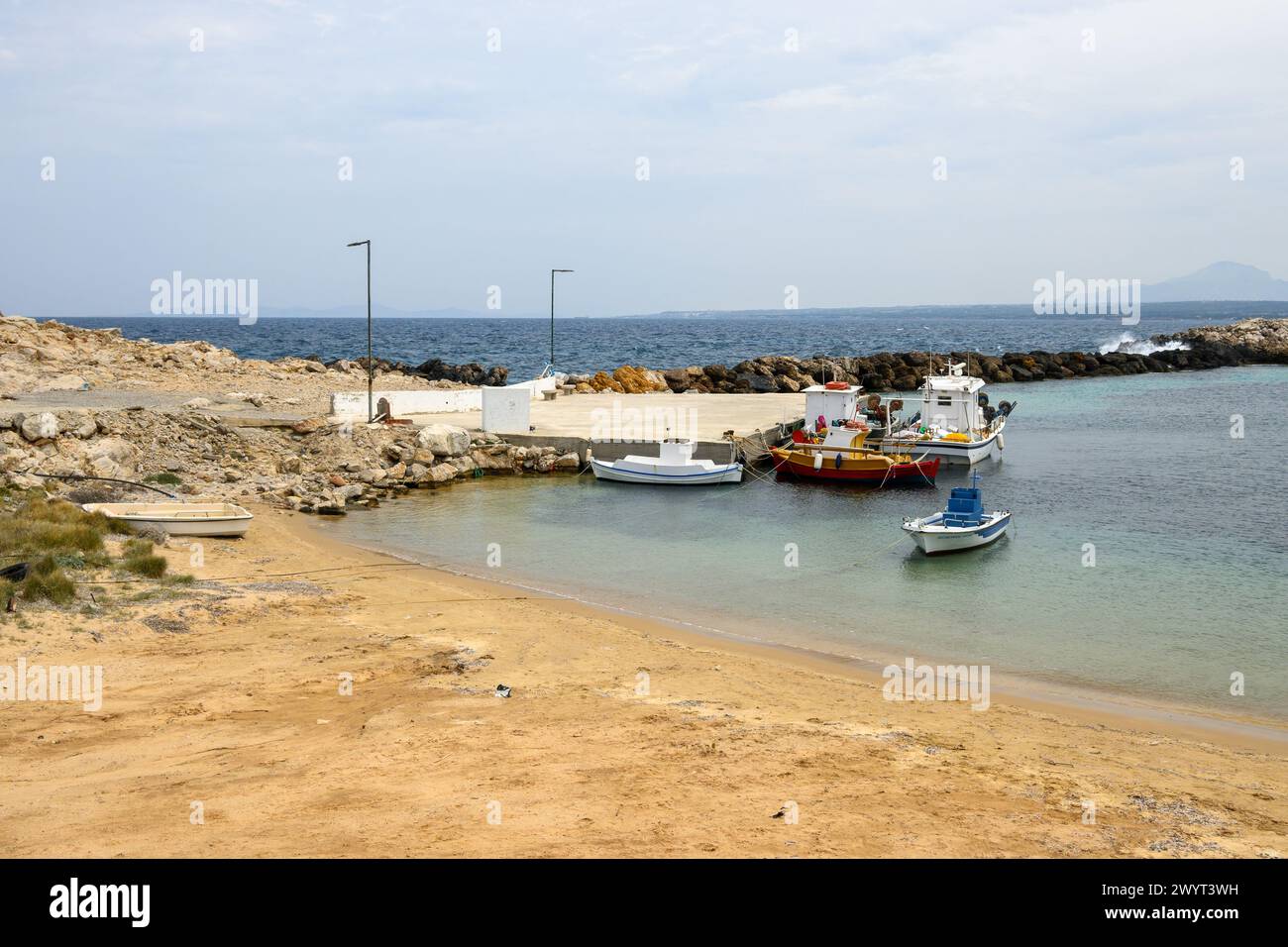 Limnionas beach with lovely calm lagoon and small port. Kos island, Dodecanese, Greece Stock Photo