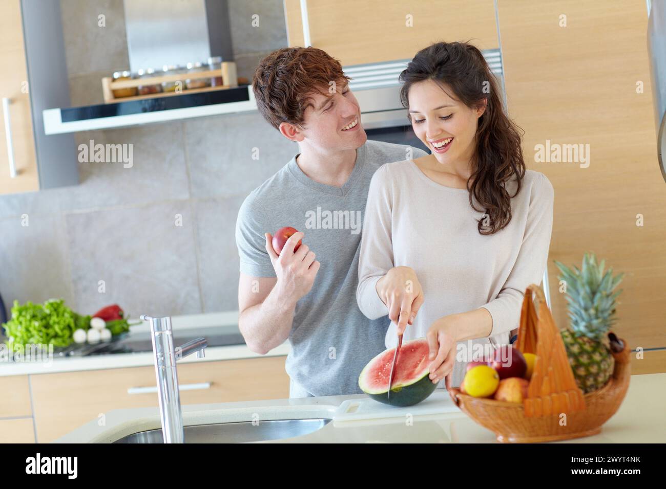 Young couple in kitchen. Stock Photo