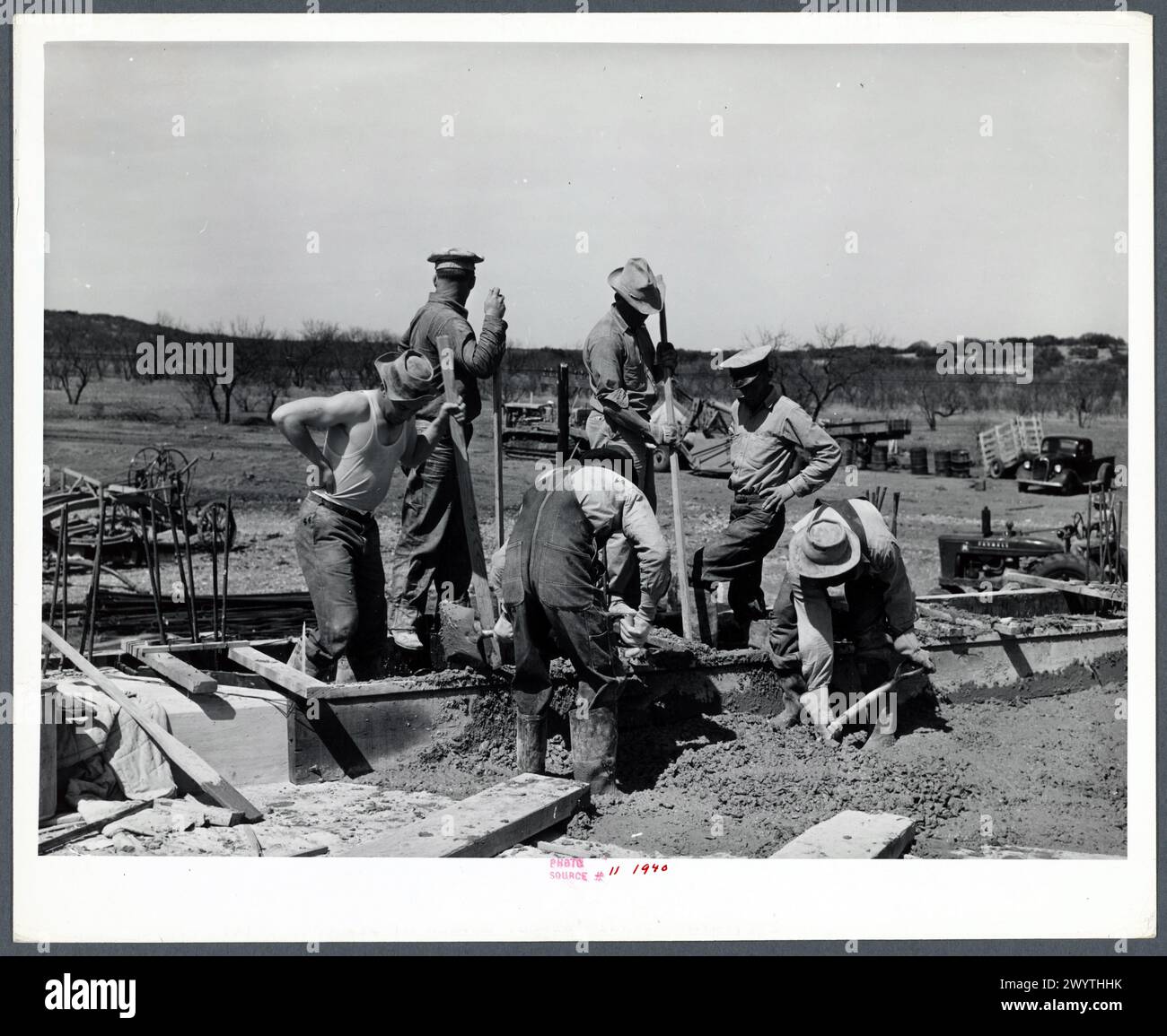 Road worker mixing concrete in Menard County, Texas Stock Photo Alamy