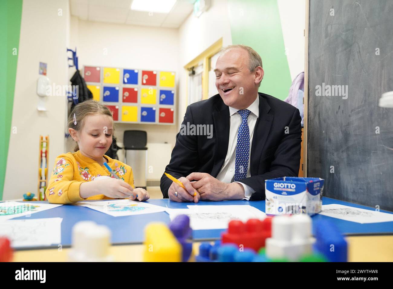 Liberal Democrat Leader Sir Ed Davey interacts with Isabel, 7, (no surname given) during a visit to SNAP in Warley, Brentford, as he proposes a national agency should be set up to support children with special educational needs and disabilities (SEND). Picture date: Monday April 8, 2024. Stock Photo