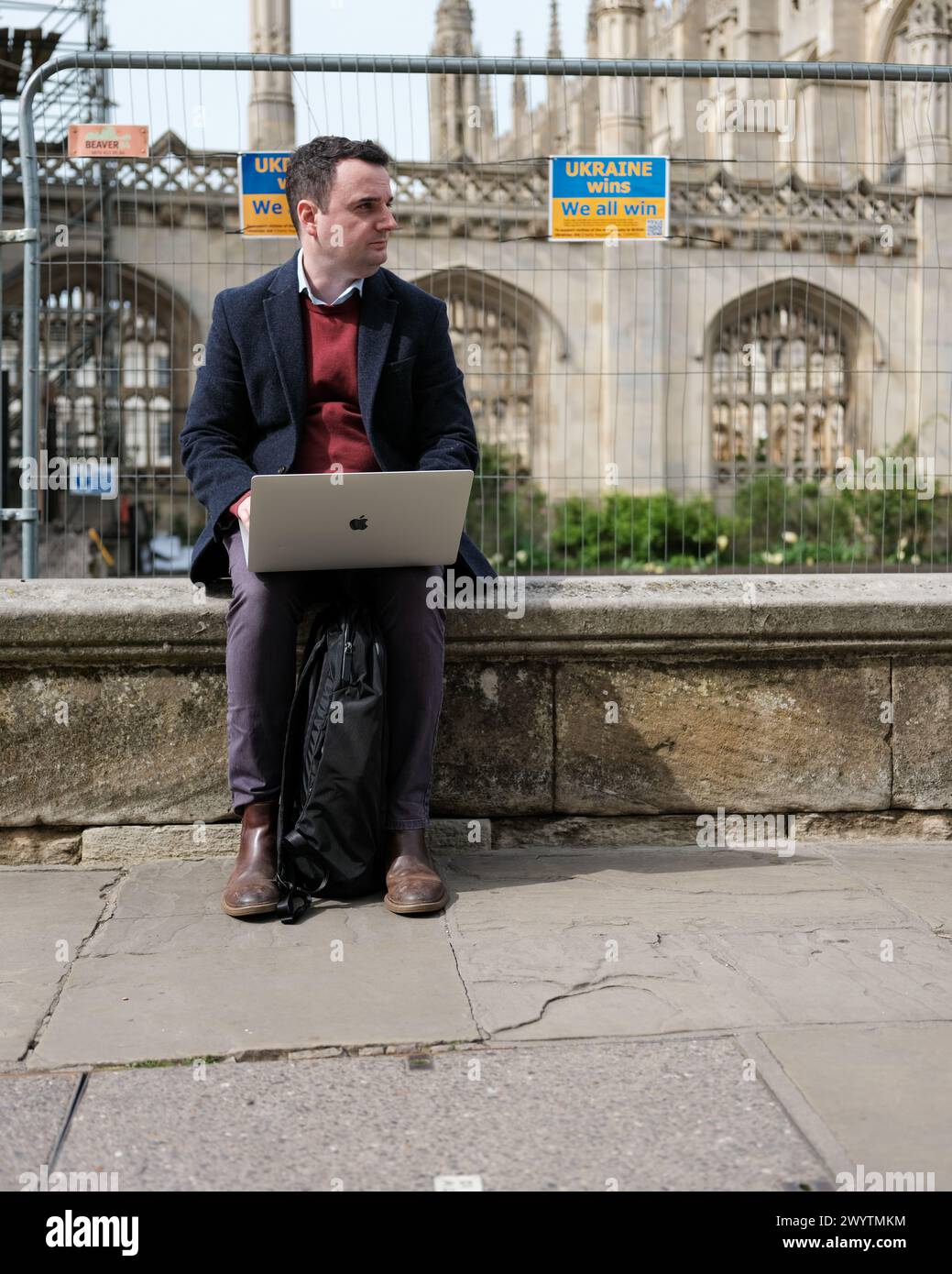 A remote worker working in a town center Stock Photo