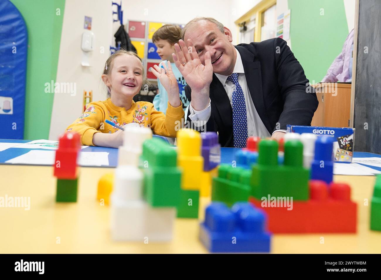 RETRANSMITTED CORRECTING LOCATION FROM Brentford TO Brentwood. Liberal Democrat Leader Sir Ed Davey interacts with Isabel, 7, (no surname given) during a visit to SNAP in Warley, in Brentwood, Essex, as he proposes a national agency should be set up to support children with special educational needs and disabilities (SEND). Picture date: Monday April 8, 2024. Stock Photo