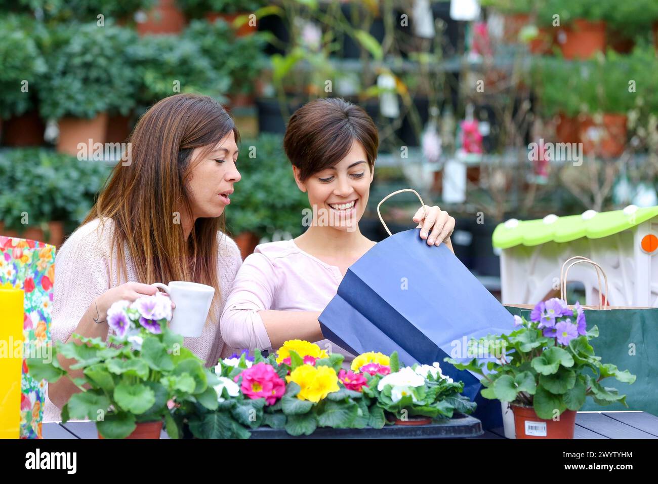 women in the garden center Stock Photo - Alamy