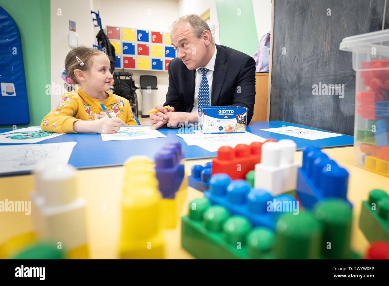 Liberal Democrat Leader Sir Ed Davey meets seven year old Isabelle during a visit to SNAP in Warley, Brentwood, Essex as he proposes a national agency should be set up to support children with special educational needs and disabilities (SEND). Picture date: Monday April 8, 2024. Stock Photo