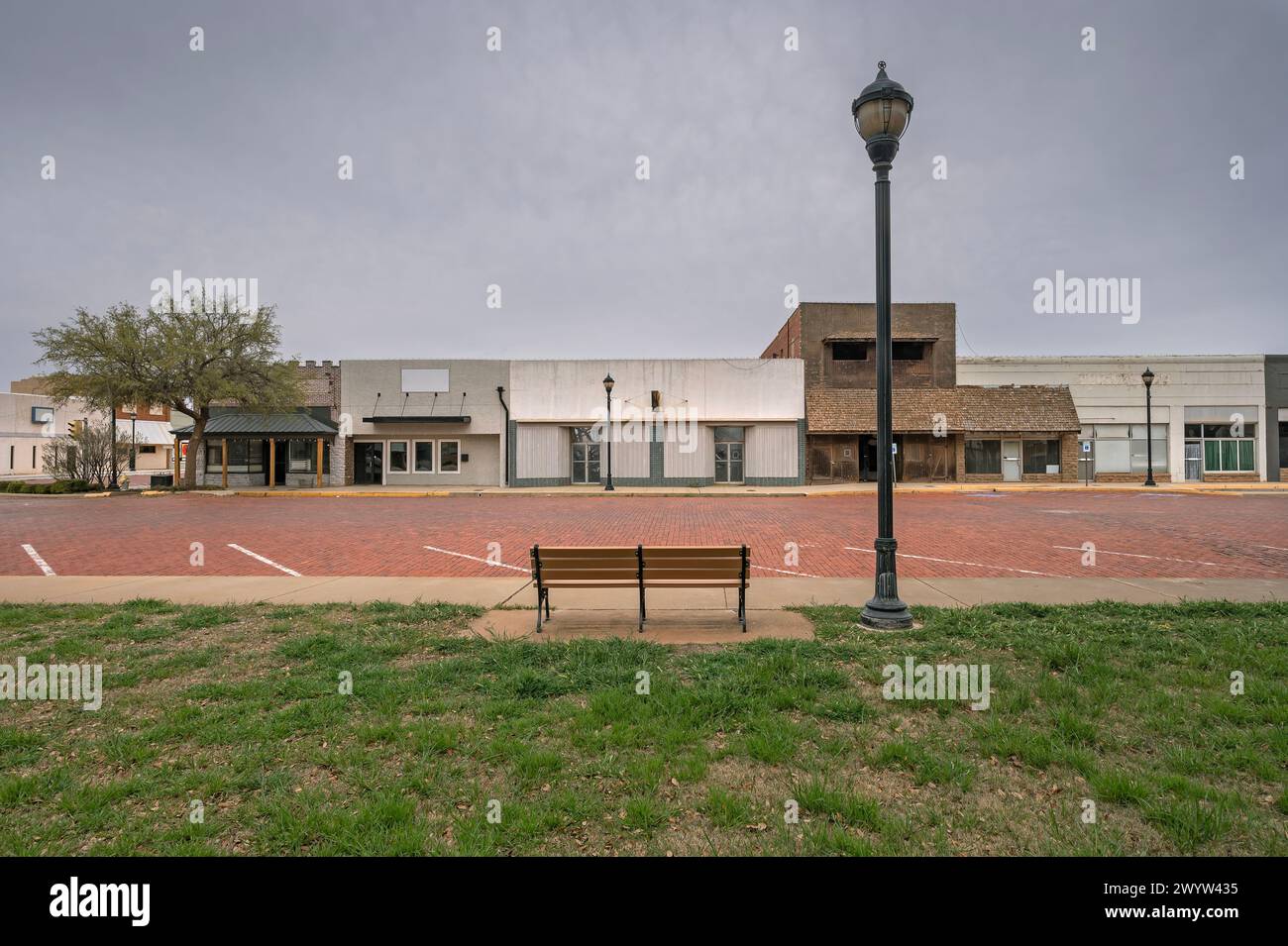 Streetscape of buildings, bench and streetlight in downtown Lamesa