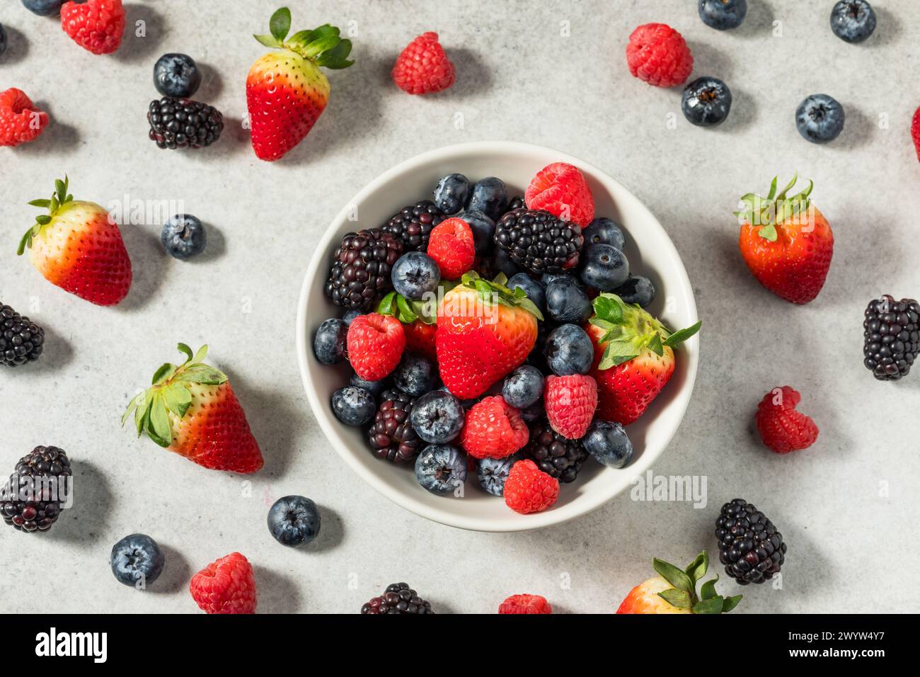 Organic Raw Mixed Berries with Blueberries Strawberries and Raspberries Stock Photo