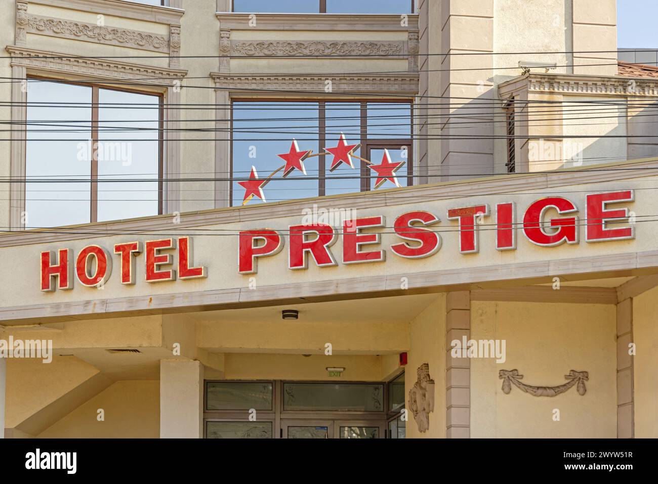Craiova, Romania - March 16, 2024: Red Sign Four Star Hotel Prestige Building at Matei Basarab Street in Old Town. Stock Photo