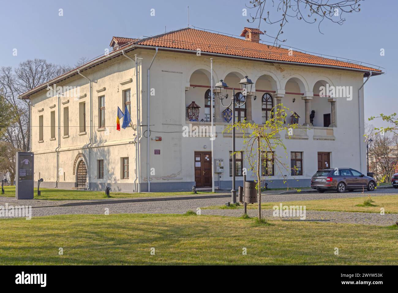 Craiova, Romania - March 16, 2024: Oltenia Museum of Ethnography Building at Town Park Sunny Spring Day. Stock Photo