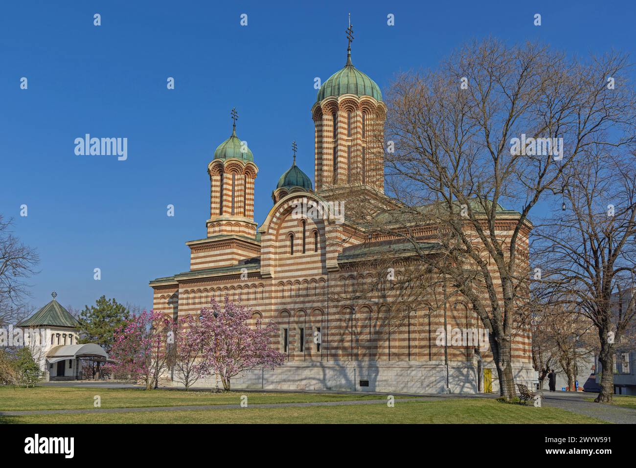 Craiova, Romania - March 16, 2024: Metropolitan Cathedral of Saint Demetrius Building at Town Park Sunny Spring Day. Stock Photo
