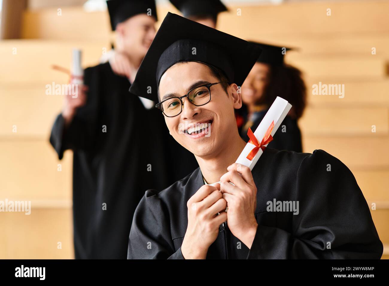 A happy man, representing diversity, graduating in cap and gown