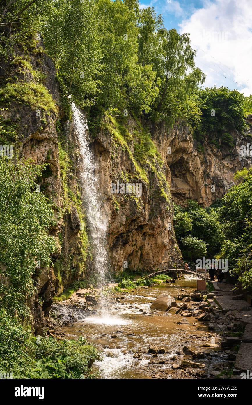 Honey Waterfalls in Kislovodsk, Russia. Water falls into gorge, vertical view of nice canyon and trees in summer. Concept of nature, travel, mountain, Stock Photo