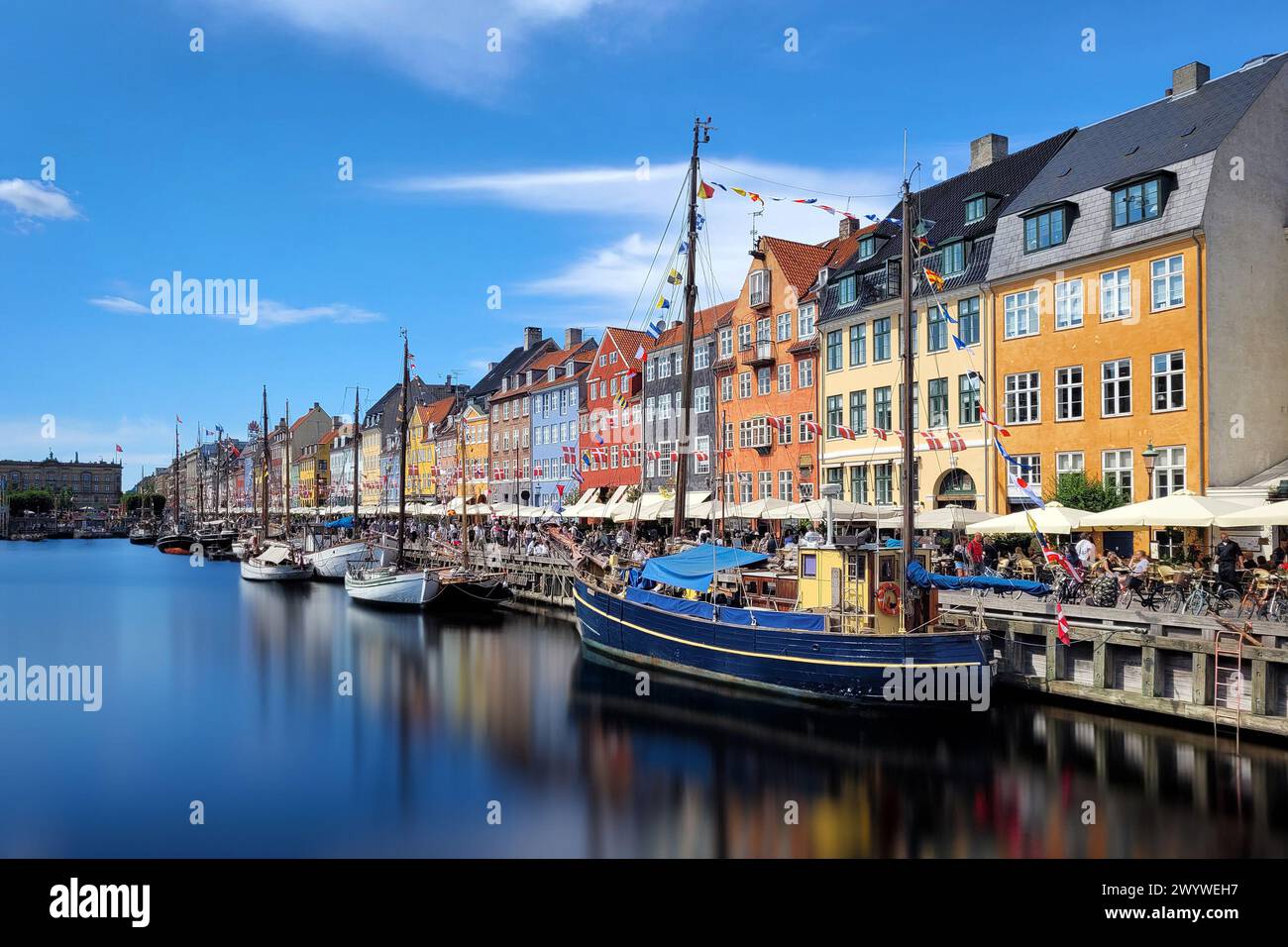 Boats and colorful buildings in Nyhavn Harbor (or New Port), Copenhagen, Denmark Stock Photo